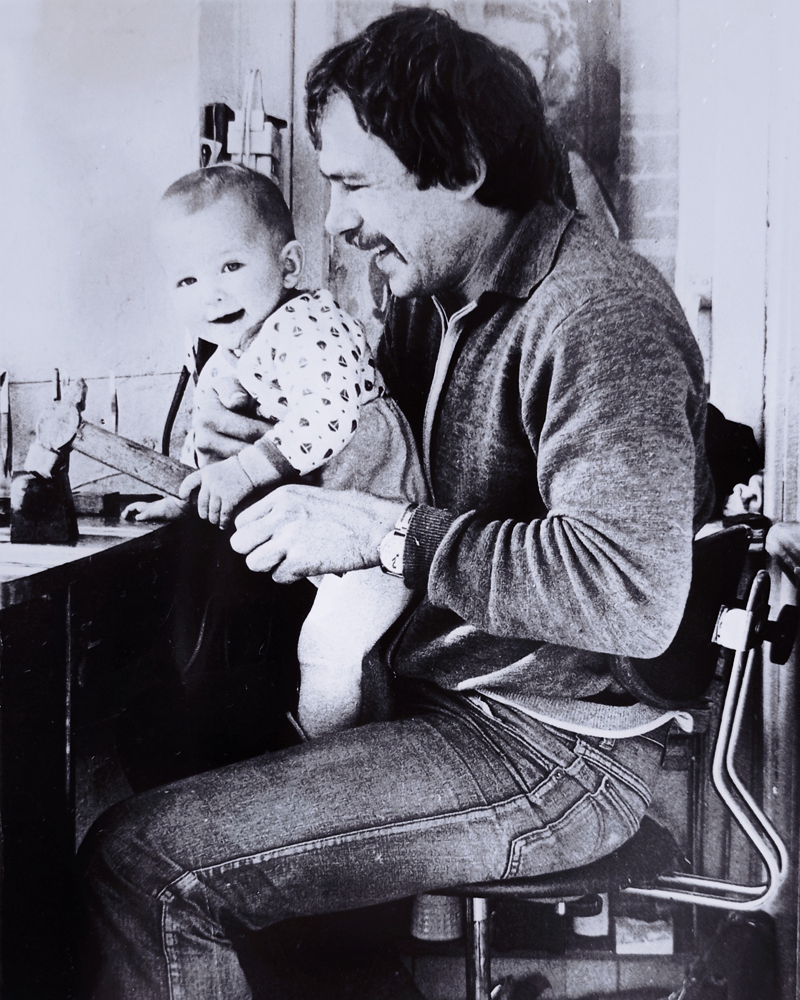 Kristina at 1 year old at her father's jewelry table in the family atelier