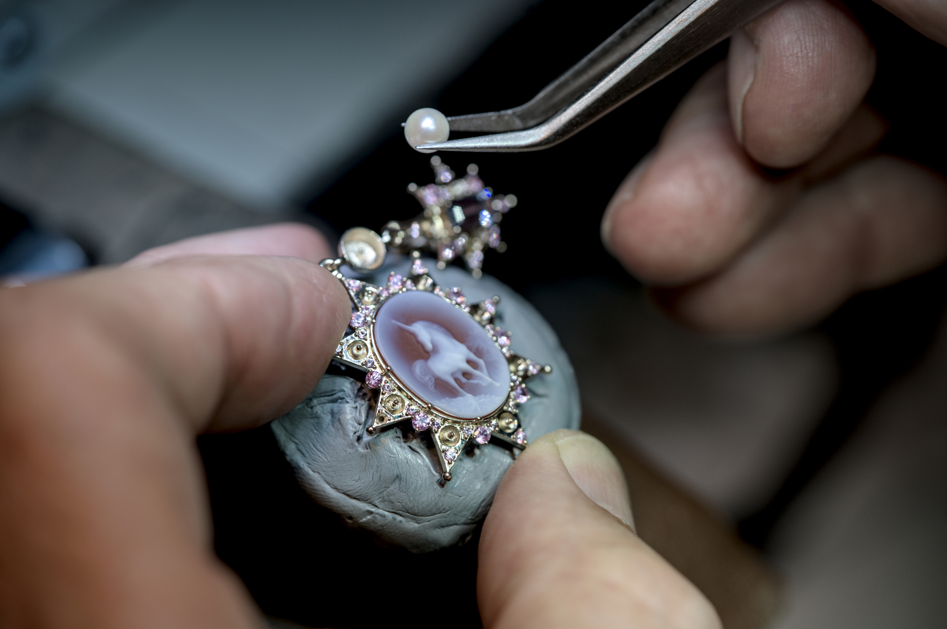 LIÉNA JEWELS cameo pendant with pink sapphires and a pearl being set by hand